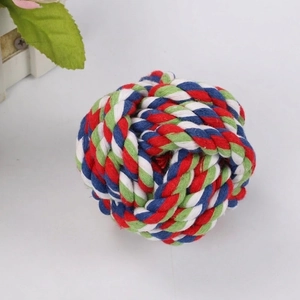 Close-up of a colorful braided cotton rope ball toy for dog teeth cleaning and chewing