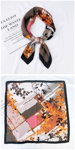 Détail d'un foulard carré en soie avec feuilles d'automne orange et motifs géométriques