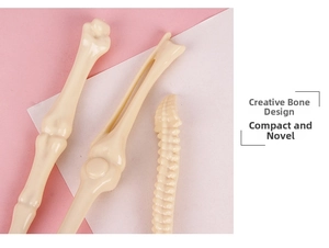 Macro view of realistic bone-shaped ballpoint pens showing detailed skeletal textures