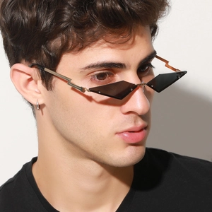 Fashion rimless geometric sunglasses with gold lightning temples and grey lenses on model