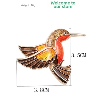 Detailed view of hummingbird brooch dimensions showing 3.8cm width and 3.5cm height