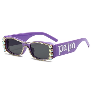 Purple rectangular sunglasses with rhinestones and palm gothic text on side