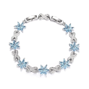 Elegant silver bracelet featuring light blue gemstone flowers and sparkling zircon accents