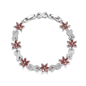 Close-up of S925 sterling silver bracelet with purple floral zircon and red petals