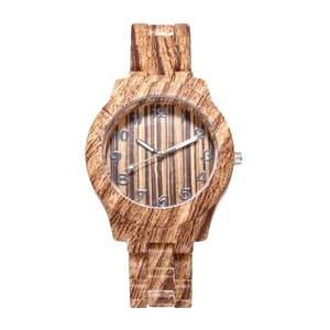 Bamboo style wooden watch with unique wood grain dial and silver numerals on white background