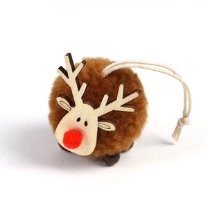 Handmade reindeer Christmas ornament with brown plush pompom and wooden deer face
