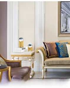 Detailed view of luxury crystal ball ornaments on golden metal stands in a modern living room