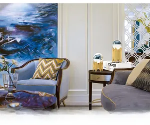 Detail of luxury gold metal bases with clear crystal spheres for modern home decor displays