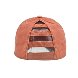 Detail of burnt orange washed cotton ponytail baseball cap with velcro back closure
