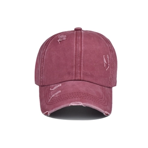 Detail view of the vintage washed cotton baseball cap with distressed brim and crown