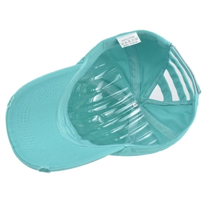 Detail view of washed cotton ponytail baseball cap featuring elastic criss-cross back straps