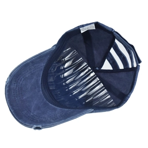 Detailed interior view of navy blue washed cotton baseball cap with quality stitching