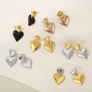 Minimalist double heart stud earrings in gold, silver, and black polished stainless steel
