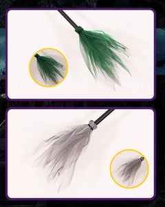 Detail view of Halloween witch brooms with green and grey tulle bristles and black handles