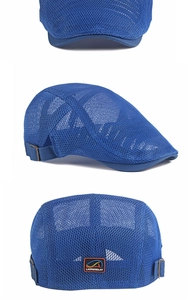 Detail of adjustable metal buckle and breathable mesh texture on kids blue beret cap