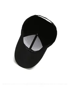 Detail view of black baseball cap interior with white breathable lining and support structure