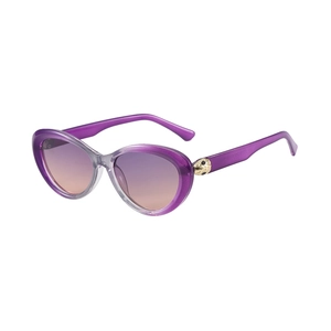 Cat eye sunglasses with purple gradient lenses and gold leopard head metal accents