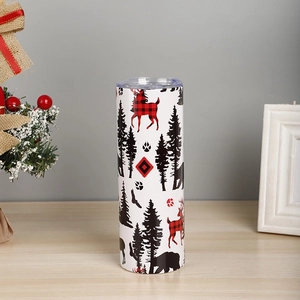 Detail of 20oz Christmas tumbler with red plaid reindeer and forest animal patterns