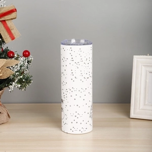 Detail of 20oz white stainless steel travel mug with silver festive Christmas patterns