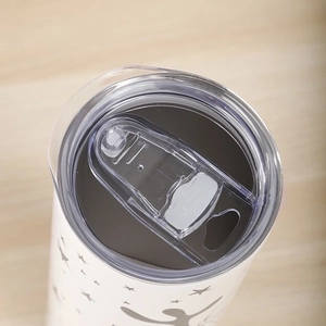 White 20oz stainless steel travel tumbler with sliding lid and cartoon star pattern