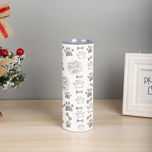 Detail of 20oz white insulated travel mug with cute cartoon dog paws and bone patterns
