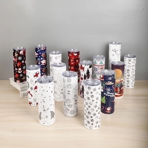 Group display of 20oz stainless steel tumblers with various festive Christmas patterns