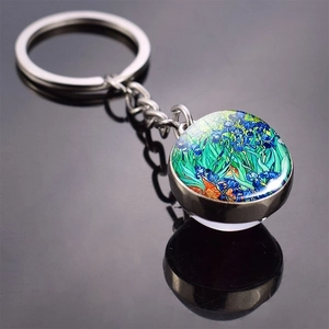Detail of Van Gogh Irises art glass ball keychain with metal ring and elegant reflection