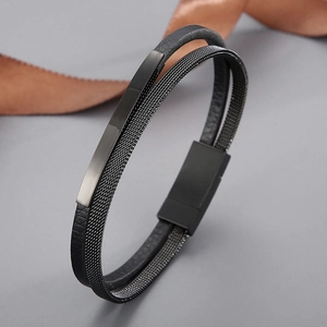 Detail of double-layer black leather and mesh metal bracelet with magnetic clasp