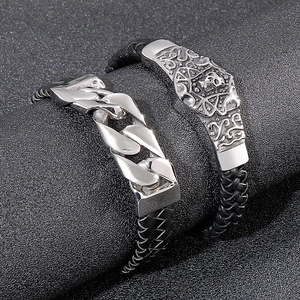 Polished silver Cuban link and skull charm bracelets with black braided leather cords