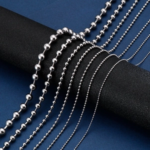 Close-up showing various thicknesses of silver stainless steel ball chain necklaces