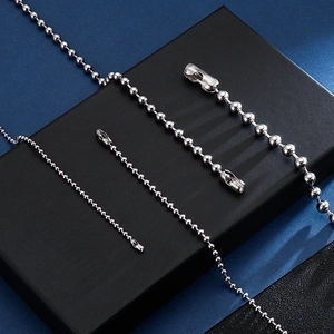 Polished titanium steel ball chain necklaces in various sizes on a premium display box