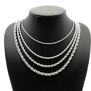Polished stainless steel twist rope chains in various lengths on a black mannequin