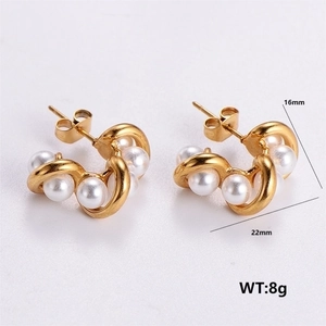 Detail showing 22mm golden C-shaped pearl earrings with 304 stainless steel finish