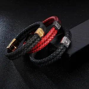 Detail of woven leather bracelets with nautical anchor metal magnetic buckles on black display