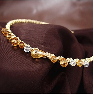 Sparkling crystal beaded headband with amber stones on gold chain and dark fabric