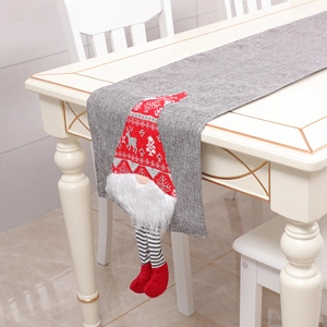 Christmas gnome table runner in red and grey fabric for festive holiday dining decor