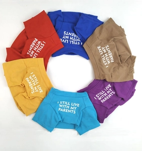 Flat lay of colorful pet T-shirts with 'I STILL LIVE WITH MY PARENTS' text print