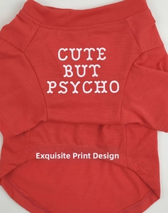 Detail of red pet T-shirt featuring high-quality white Cute But Psycho printed text