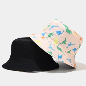 Reversible bucket hat with cute dinosaur prints and solid black design for sun protection