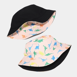 Reversible bucket hat with cute dinosaur prints and solid black side for sun protection