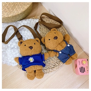 Detail of plush teddy bear bags in blue daisy tee and denim overall styles