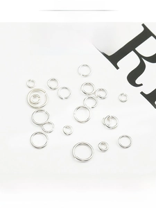 Macro shot of 925 sterling silver open jump rings in various sizes for DIY jewelry making
