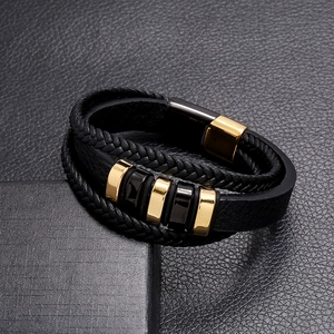 Men's multi-layer black braided leather bracelet with gold magnetic clasp on gift box