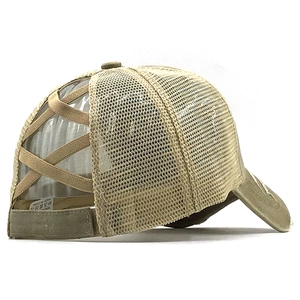 Detail view of khaki mesh ponytail baseball cap with criss-cross elastic straps and velcro