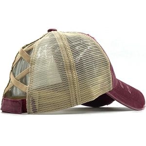 Detail of burgundy washed canvas ponytail baseball cap with breathable mesh and elastic straps