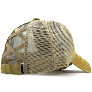 Detail of khaki ponytail trucker hat with elastic criss-cross straps and mesh back