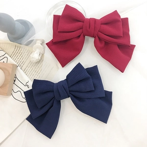 Elegant oversized layered bubble gauze bow hair clips in red and navy blue fabric