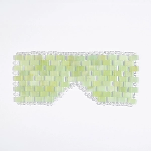 Close-up of handmade light green jade eye mask woven with rectangular stone pieces
