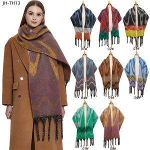 Thick oversized scarf with wavy pattern and long tassels in vibrant color blocking