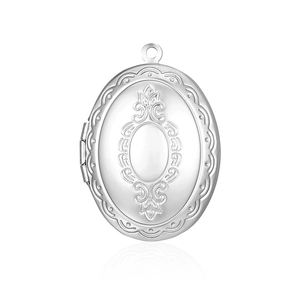 Detailed view of silver oval locket pendant with intricate vintage floral engravings